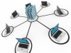 Abstract computer network with laptops and archive or database.